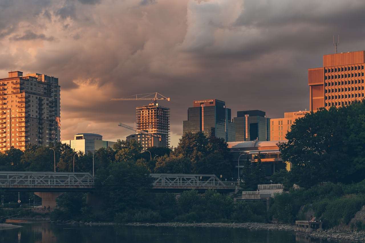 A beautiful evening view of London's skyline with dramatic clouds and sunset light.